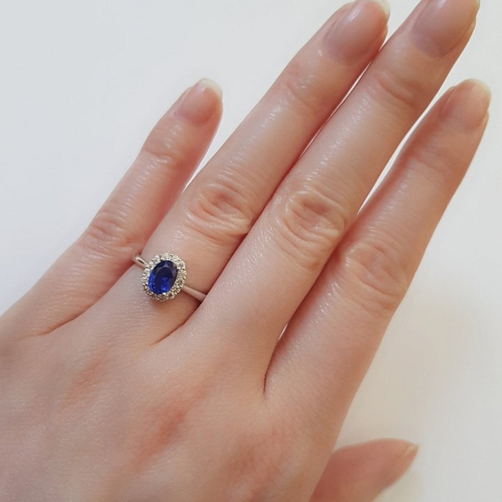 Sterling Silver Blue Oval Halo Ring Created with Swarovski Zirconia